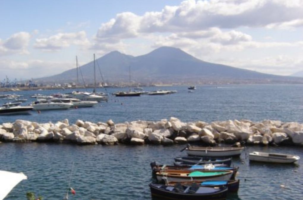 The bay of Napoli with fishing boats and Vesuvio in the distance