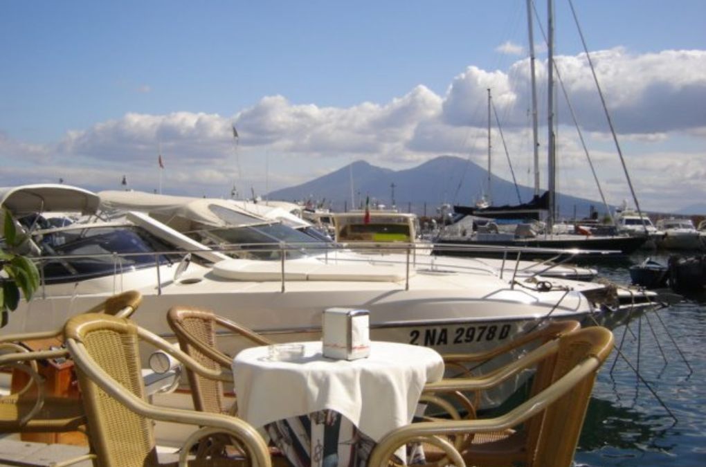 A café table overlooking the bay of Napoli with Vesuvio in the background