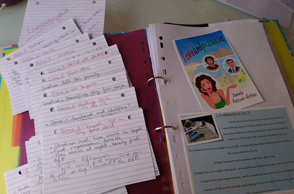 Handwritten scene planning cards beside an early illustrated cover concept for Loveandpizza.it
