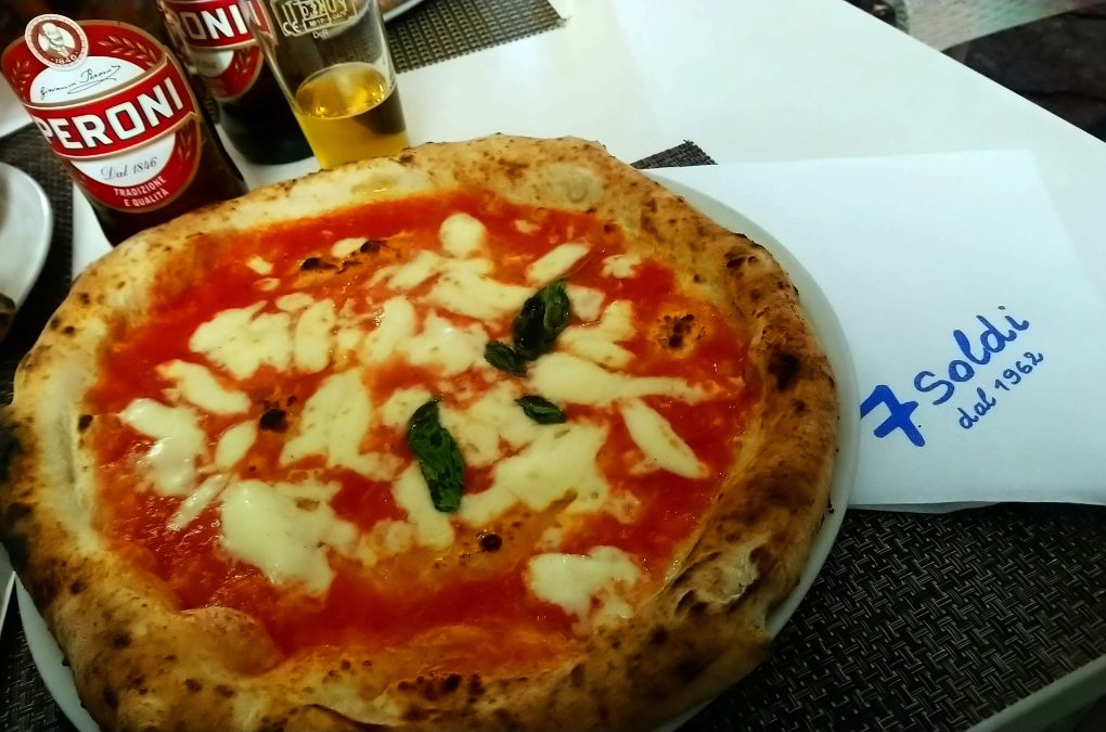A traditional Neapolitan Margherita pizza at 7 Soldi pizzeria in Naples