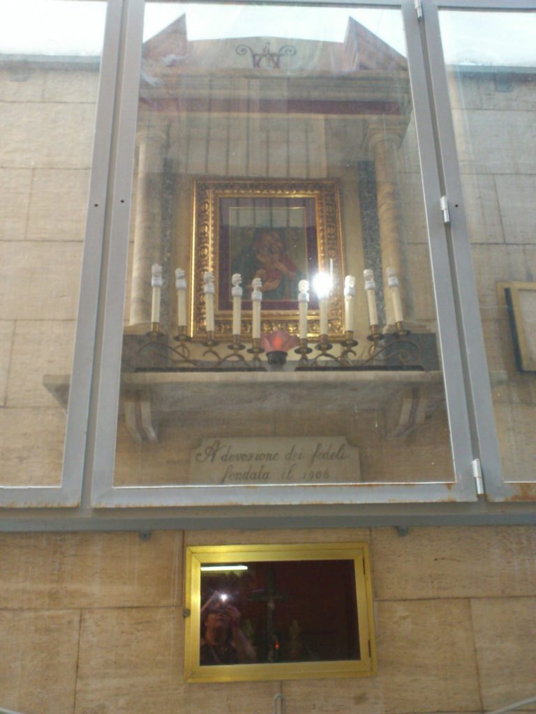 A street shrine in Naples with a crowned Madonna and Child